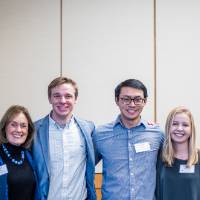 Jim and Donna Brooks standing with students.